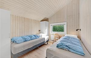 En eller flere senge i et værelse på Lovely Home In Kerteminde With Wifi