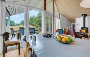 a kitchen with a table with a bowl of fruit on it at 3 Bedroom Stunning Home In Fan in Fanø
