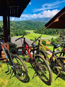 three bikes parked next to each other on the grass at Motho Homestay โมโทโฮมสเตย์ in Chom Thong
