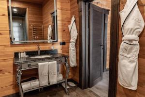 a bathroom with a sink and a shower at Le Chalet by Amirsoy in Chimgan
