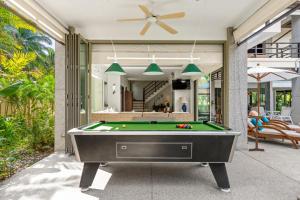 een pooltafel voor een huis bij Villa Luxe - Ultra Luxury 4 Bedroom in Koh Samui 