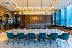 a large conference room with a large table and chairs at Son&Henry The MarQ Luxury in Ho Chi Minh City