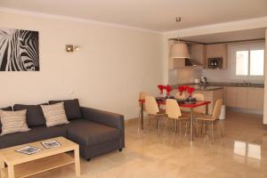 a living room with a couch and a table at Apartment in Las Palmeras de Calahonda in Mijas Costa
