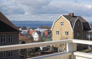 a view of a city with houses and the water at Stunning Home In Huskvarna With 3 Bedrooms And Wifi in Huskvarna