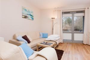 Posezení v ubytování Apartamenty Bałtycka by Noclegi Renters