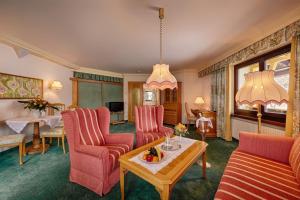 Postel nebo postele na pokoji v ubytování Thermenwelt Hotel Pulverer