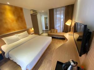 Postel nebo postele na pokoji v ubytování Liberta Hotel Jimbaran