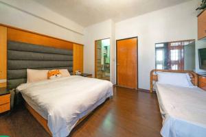 Postel nebo postele na pokoji v ubytování Shan Shui B&B