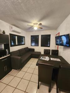 a living room with a couch and a table at VERY SECURED HOUSE 7 MINUTES FROM THE BEACH in Puerto Peñasco