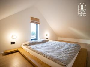Postel nebo postele na pokoji v ubytování Terra House