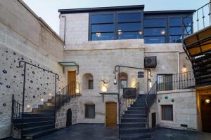 a building with stairs in front of it at The Niche Cave Hotel in Goreme