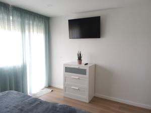 Televízia a/alebo spoločenská miestnosť v ubytovaní Apartamento con estupendas vistas