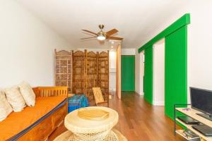 TV a/nebo společenská místnost v ubytování Exotica - En plein cœur de St Gilles les Bains