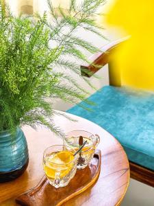 a glass bowl of orange juice on a wooden table at Tuna Hotel Phú Yên in Liên Trì (3)