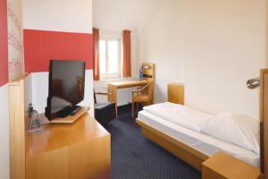 TV a/nebo společenská místnost v ubytování Hotel Der Achtermann