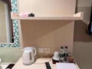 a toy kitchen with a coffee maker on a counter at Reka Hotel Genting Highlands in Genting Highlands