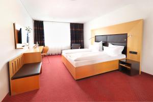 Postel nebo postele na pokoji v ubytování Hotel Der Achtermann