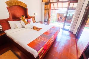 Postel nebo postele na pokoji v ubytování SwaSwara Wellness - A CGH Earth Experience, Gokarna