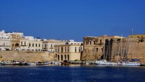 a group of boats are docked in a harbor at Appartamento Eucalpti Baia Verde By Nonsolomare Case Vacanze srlu in Baia Di Gallipoli