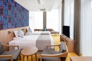 Postel nebo postele na pokoji v ubytování HOTEL MYSTAYS Nishi Shinjuku