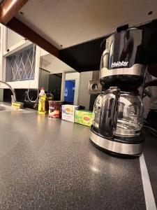 a coffee maker sitting on top of a kitchen counter at Feel like home Concert hall Apartment - Sem in Athens