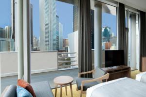 a hotel room with a view of the city at HOTEL MYSTAYS Nishi Shinjuku in Tokyo