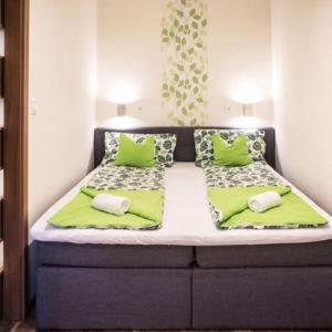 Postel nebo postele na pokoji v ubytování Ariel apartman