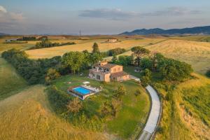an aerial view of a house in a field at Podere I Sorbi, Spacious Tuscan Villa, Lajatico, Nr Pisa in Molino Mazzetti