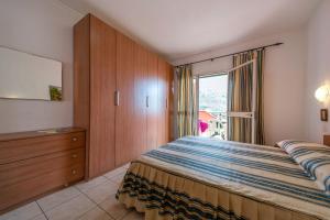 A bed or beds in a room at Villetta Grazia