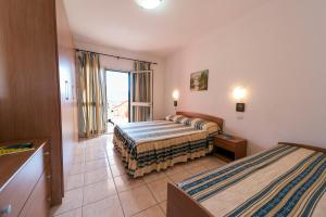 A bed or beds in a room at Villetta Grazia