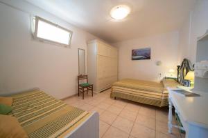 A bed or beds in a room at Villetta Grazia