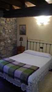 Ένα ή περισσότερα κρεβάτια σε δωμάτιο στο Casa Rural Garro