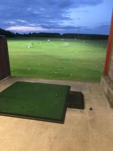a view of a golf course with a green field at Berryhill West Steading - Sleeps 5 - Dog Friendly - Peterhead 1 mile - EV Point - Golf Driving Range - Rural Location in Peterhead
