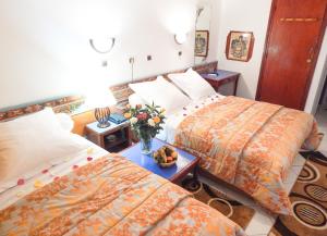 Postel nebo postele na pokoji v ubytování Hotel Sindibad