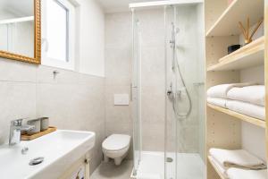 Koupelna v ubytování Selamare Apartment by Locap Group