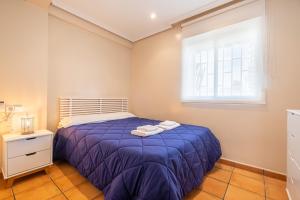 Łóżko lub łóżka w pokoju w obiekcie Penthouse Ancla 562 Levante Beach