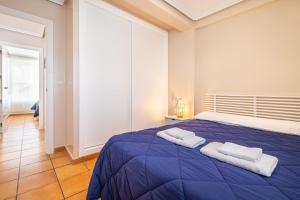 Łóżko lub łóżka w pokoju w obiekcie Penthouse Ancla 562 Levante Beach