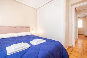 Łóżko lub łóżka w pokoju w obiekcie Penthouse Ancla 562 Levante Beach