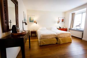 Un pat sau paturi într-o cameră la Ter Heide (Kaprijke - Lembeke)