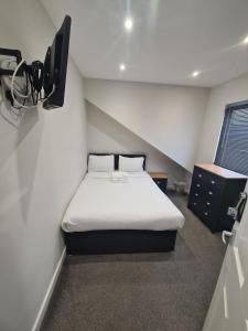 APARTMENT in BARNSLEY CENTRAL客房内的一张或多张床位