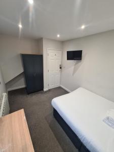 APARTMENT in BARNSLEY CENTRAL客房内的一张或多张床位