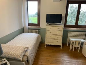 Ένα ή περισσότερα κρεβάτια σε δωμάτιο στο Il casale di Tata