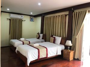 Un pat sau paturi într-o cameră la Xayana Home Villas