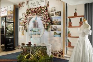 a wedding dress and a table in a store at Hotel Ciputra Jakarta managed by Swiss-Belhotel International in Jakarta