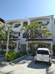 a white van parked in front of a building at Xarraca in Bayahibe