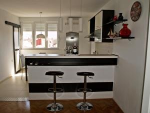 Kuchyňa alebo kuchynka v ubytovaní Apartment Roxy