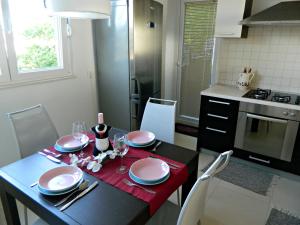 Kuchyňa alebo kuchynka v ubytovaní Apartment Roxy