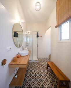 a bathroom with a sink and a mirror at Alleanza, Aires de Guadalquivir in Seville +16 photos