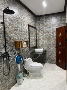 a bathroom with a toilet and a sink at Xayana Home Villas in Luang Prabang