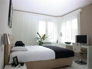 Postel nebo postele na pokoji v ubytování Stay2Night Rotachstrasse